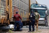 Freight train slams into a bus outside Mexico City and kills at least 10 people