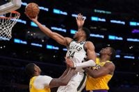 NBA: Bucks Thrash Lakers; Pacers Win In OT; Curry Injured In Warriors Victory