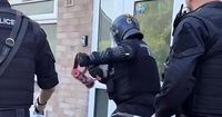 Two arrested in police raid as officers find suspected drugs