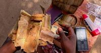 A rebel-held Congolese city uses damaged banknotes due to a cash shortage